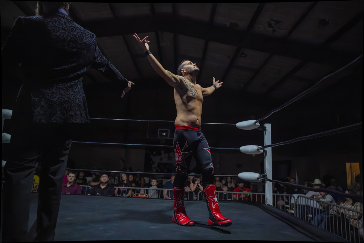 Arms raised in victory in the ring