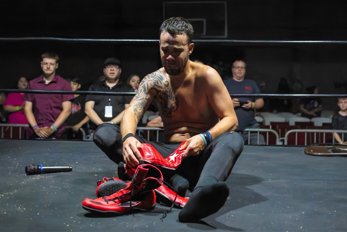 Matt Young leaving his boots in the ring after his final match
